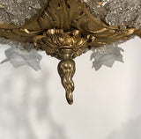 A Belle Epoque Eight Arm Chandelier Modelled with Dionysis/Bacchus Masks