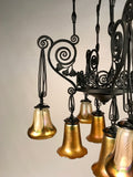 French Art Deco Iron Eight-Light Chandelier with Quezal Shades