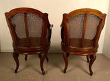 Pair of French Louis XV Style Walnut & Caned Swivel Armchairs
