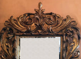 Italian giltwood  Baroque mirror in boldly carved frame